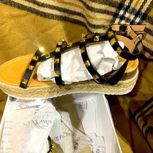 Size 7 black platform gladiator sandals by Mata shoes.